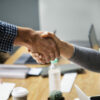 Business people shaking hands in agreement